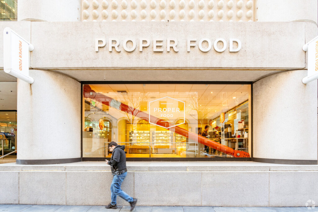 Exterior view looking at Taylor damper through a shop window at 350 California St.