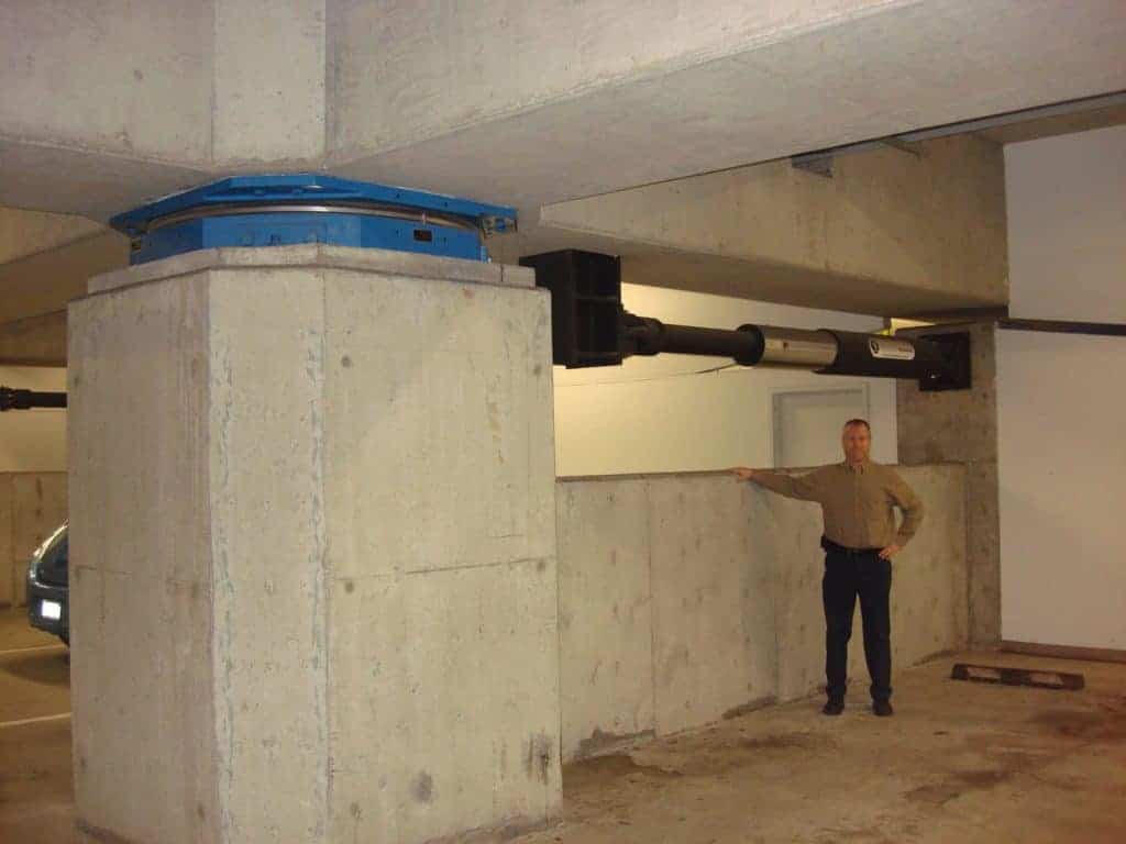 Picture of man next to base isolation system