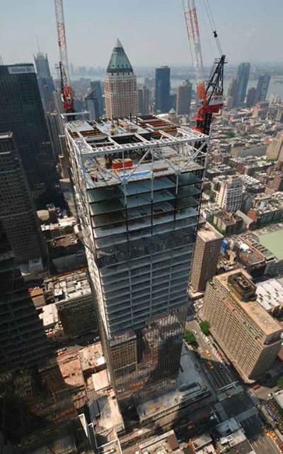 Damped outrigger being added to a building being constructed